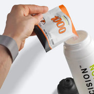 Hydration Powder by Precision Fuel & Hydration in white and orange packet with electrolyte mix for athlete hydration and sweat replacement