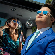 Middle Seat Advantage by Goodr in clear frame and blue mirrored lenses, slim fit sunglasses with glare reduction for smaller faces and outdoor use