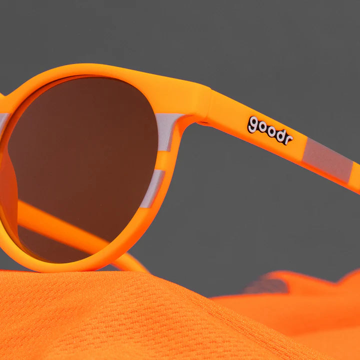 Face Under Construction by Goodr in bright orange and reflective silver with orange lenses, lightweight glasses ideal for outdoor running and sports