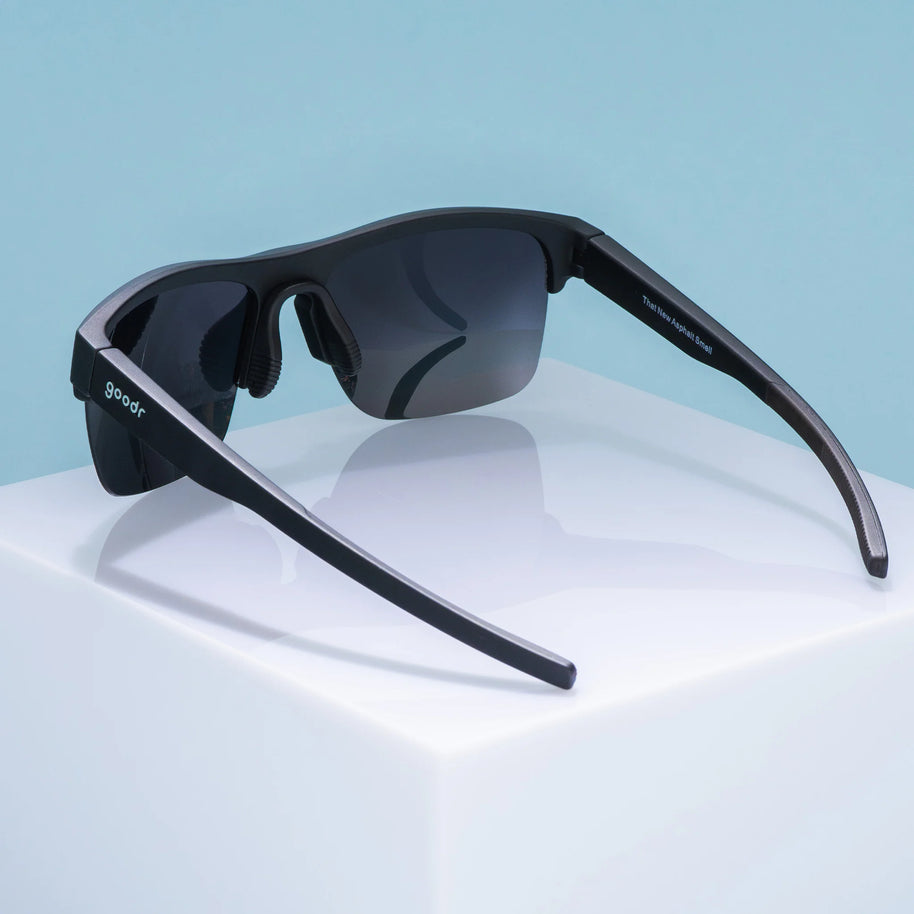 That New Asphalt Smell by Goodr in black with dual-lens wrap frame half-rim sunglasses ideal for running outdoors