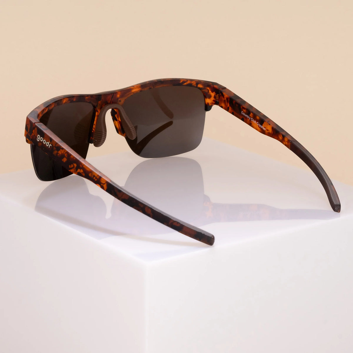 Country Club Crasher by Goodr in brown tortoiseshell with half-rim wrap frame and adjustable nose piece for stylish outdoor use