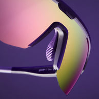 Tentacle Tag Champion by Goodr in purple shield sunglasses with half-rim frames and pink reflective lenses for athletic use