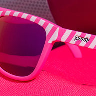 Road Twerk Ahead by Goodr electric pink glasses with hazard stripe design, rose reflective lenses, ideal for outdoor alertness and fun style