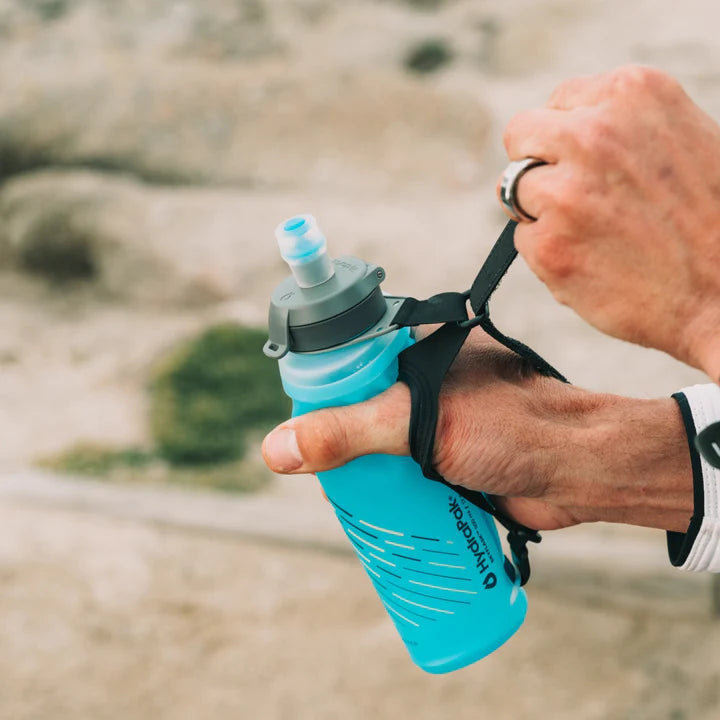 SkyFlask Speed by Hydrapak in blue with thumb loop, handheld hydration flask designed for runners to secure grip and conserve energy