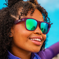 Colossal Squid Confessions sunglasses by Goodr in purple with green reflective lenses, lightweight glasses ideal for outdoor use