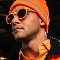 Face Under Construction by Goodr in orange and reflective silver with orange lenses, lightweight glasses for outdoor use and high visibility