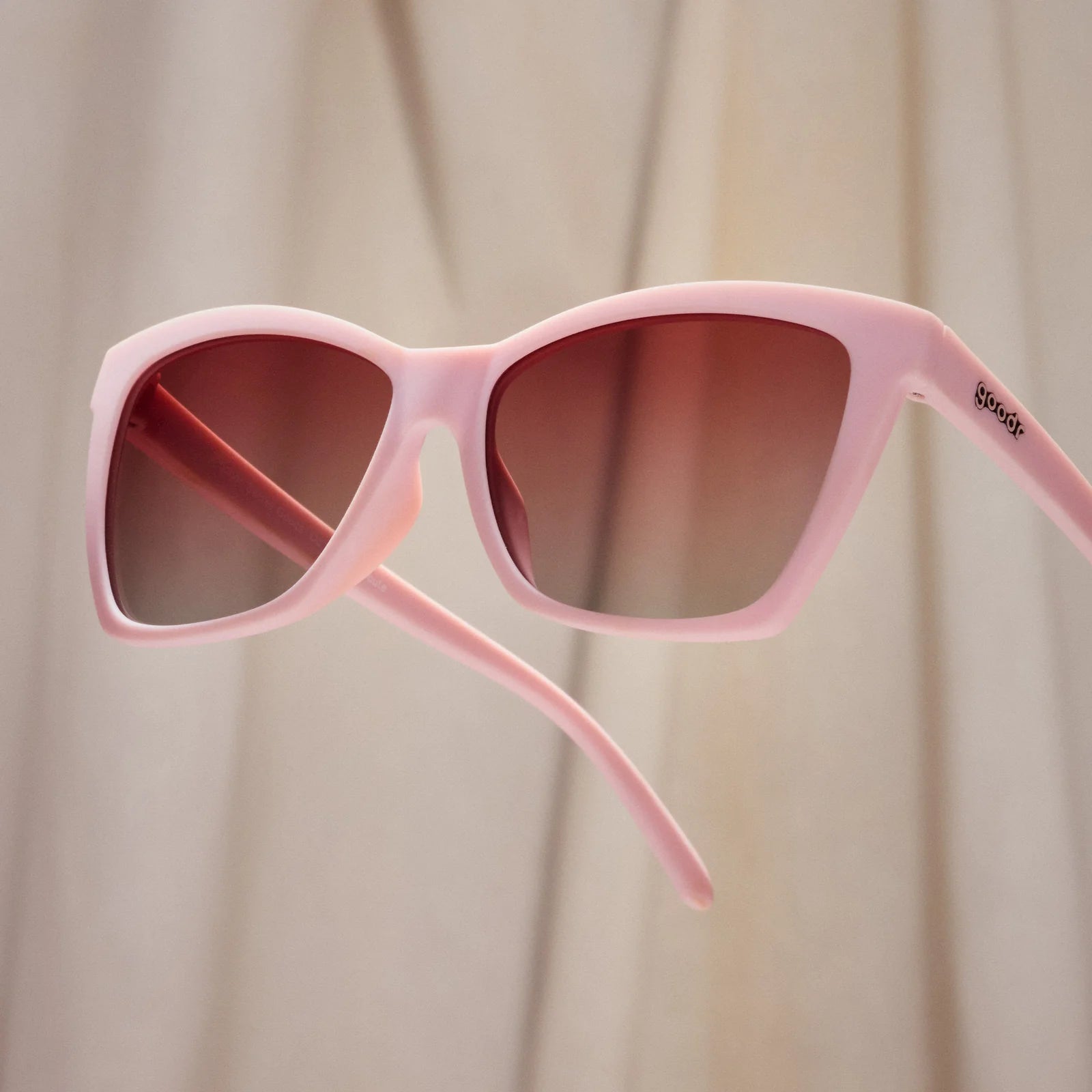 Rosé Retail Therapy by Goodr in light pink with rose ocean gradie lenses, lightweight sunglasses perfect for stylish outdoor use