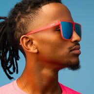 Entourage Sold Separately by Goodr in translucent hot pink with teal reflective lenses, stylish sunglasses for bold outdoor looks