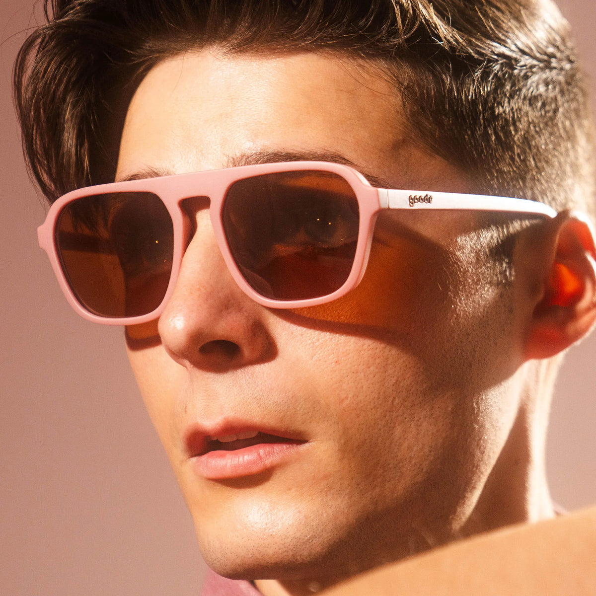 Threaten Me With a Good Time by Goodr in light pink vintage aviator frames with brown lenses, non-slip for roller rink use