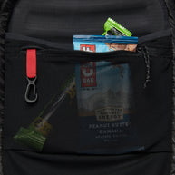 Distance 15 Backpack - Women (Prior Season) by Black Diamond in black with mesh pocket, hybrid design for alpine running and scrambling days