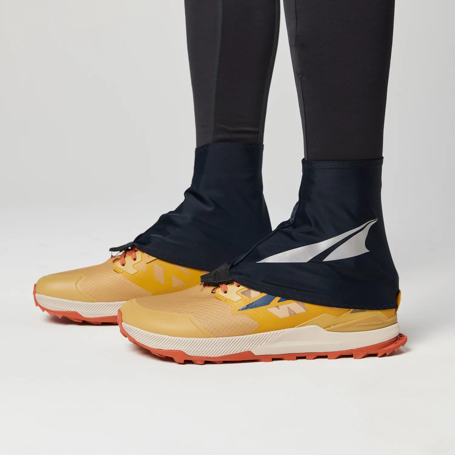 Trail Gaiter by Altra Footwear in black designed for abrasion resistance and breathability to keep shoes clean during trail running