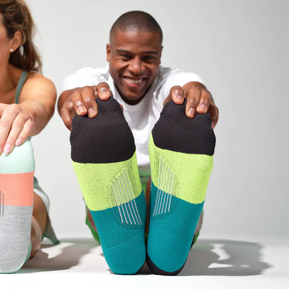 Elite Ultra Light Cushion No Show Tab - 2023 by Feetures in black, green, teal anatomically designed running socks with targeted compression