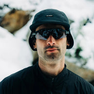 FLTCap WND - Ultra Iconic by Ciele in black with fold away ear flaps, cold weather headwear for running and outdoor use in Canada