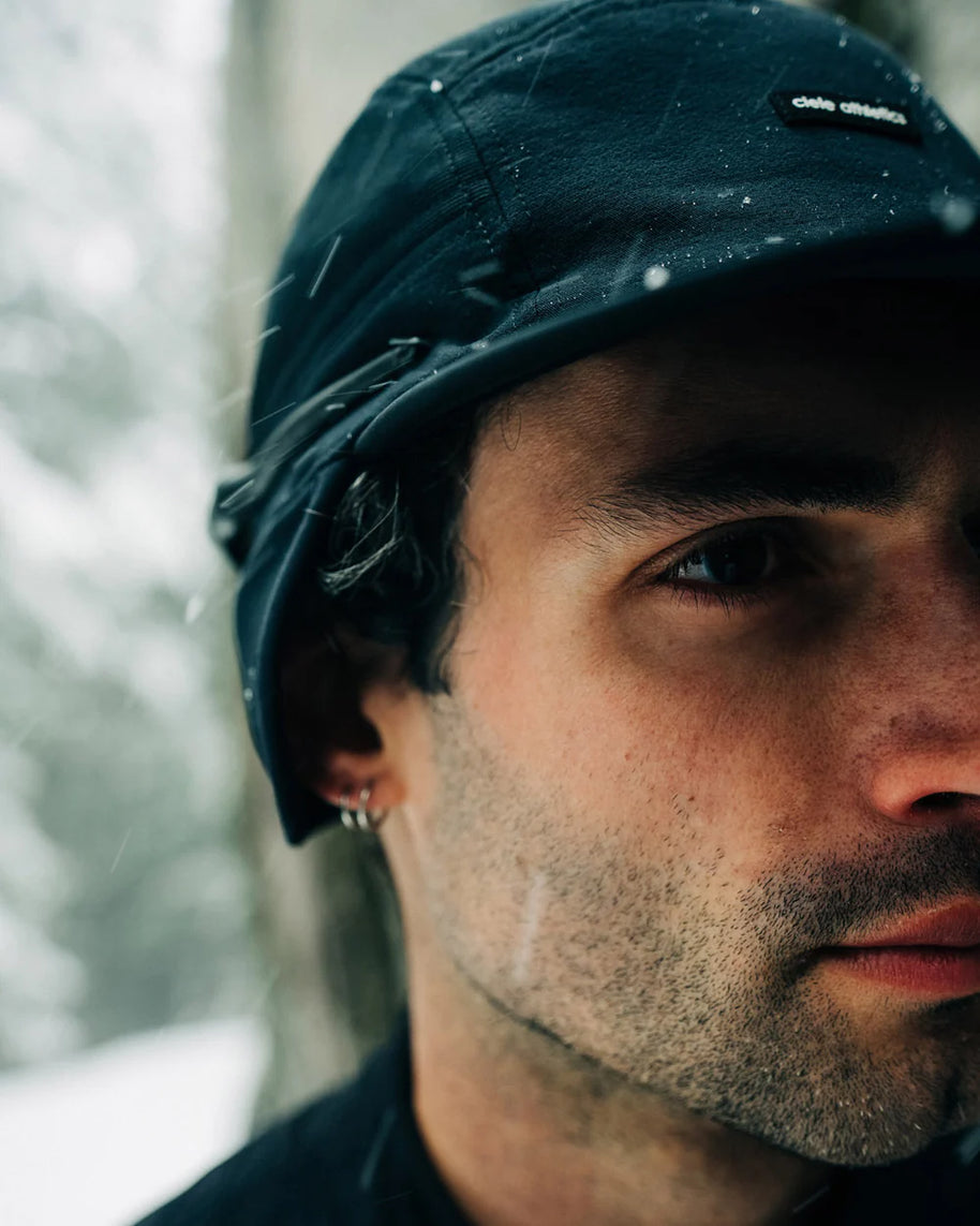 FLTCap WND - Ultra Iconic in black by Ciele, fold-away ear flaps for cold weather, men’s headwear for running in Canada