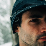 FLTCap WND - Ultra Iconic in black by Ciele, fold-away ear flaps for cold weather, men’s headwear for running in Canada