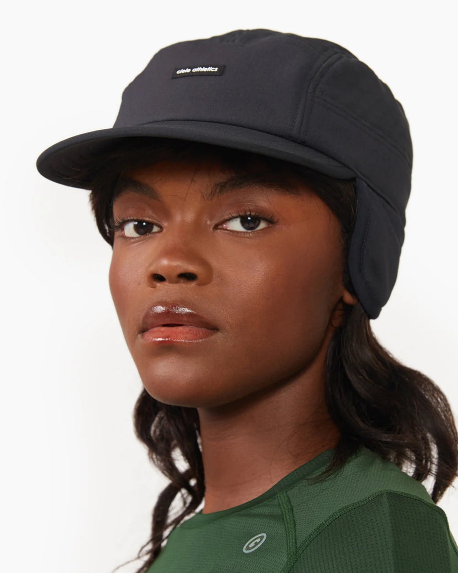 FLTCap WND - Ultra Iconic by Ciele in black with fold-away ear flaps, cold weather headwear for running and outdoor use in Canada