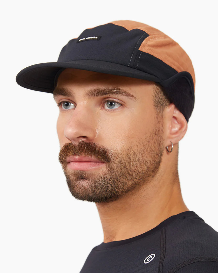 FLTCap WND - Ultra Iconic by Ciele in black and brown with fold-away ear flaps for cold weather running and outdoor use in Canada