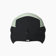FLTCap WND - Ultra Iconic by Ciele in black and light green cold weather headwear with fold away ear flaps for icy conditions