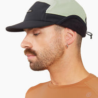 FLTCap WND - Ultra Iconic by Ciele in black and light grey, cold weather cap with fold-away ear flaps for winter running and outdoor use