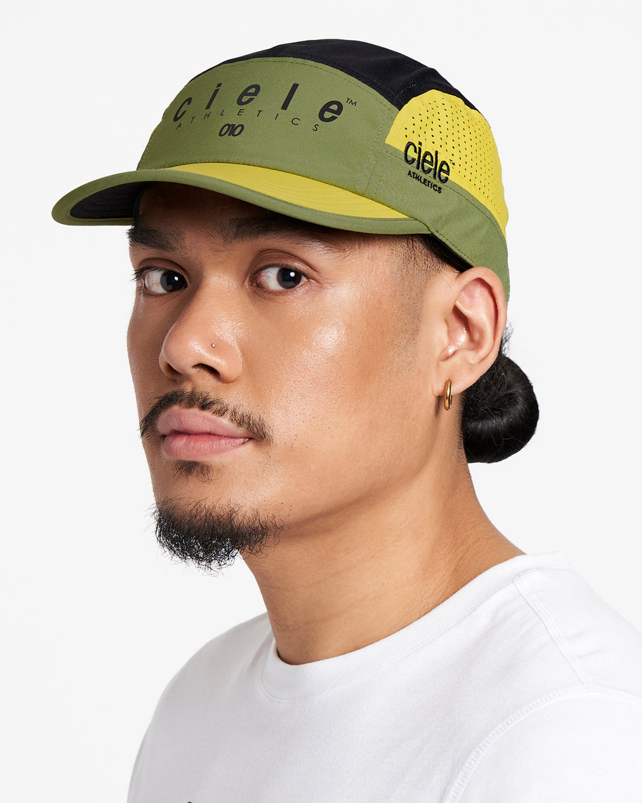 GOCap SC - Decade by Ciele in olive green and yellow with SOFTcurve brim, breathable running cap designed for long-distance comfort and protection