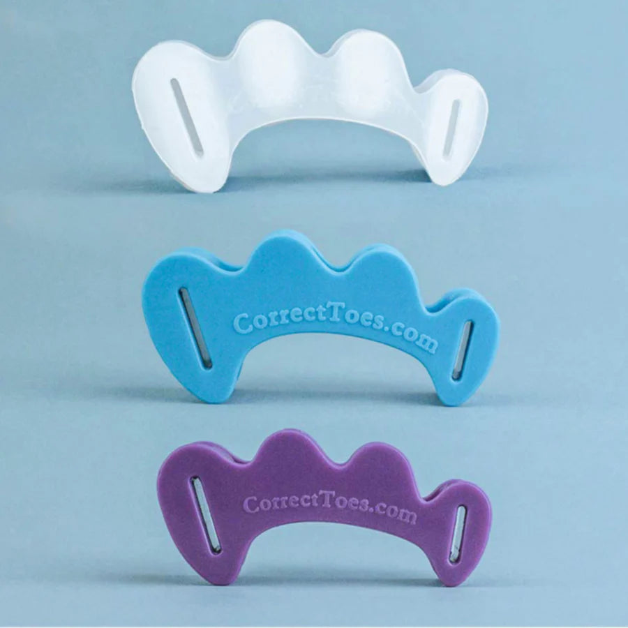 Correct Toes Original by Correct Toes in white, blue, and purple, toe spacers designed to align, strengthen, and restore foot health without surgery.