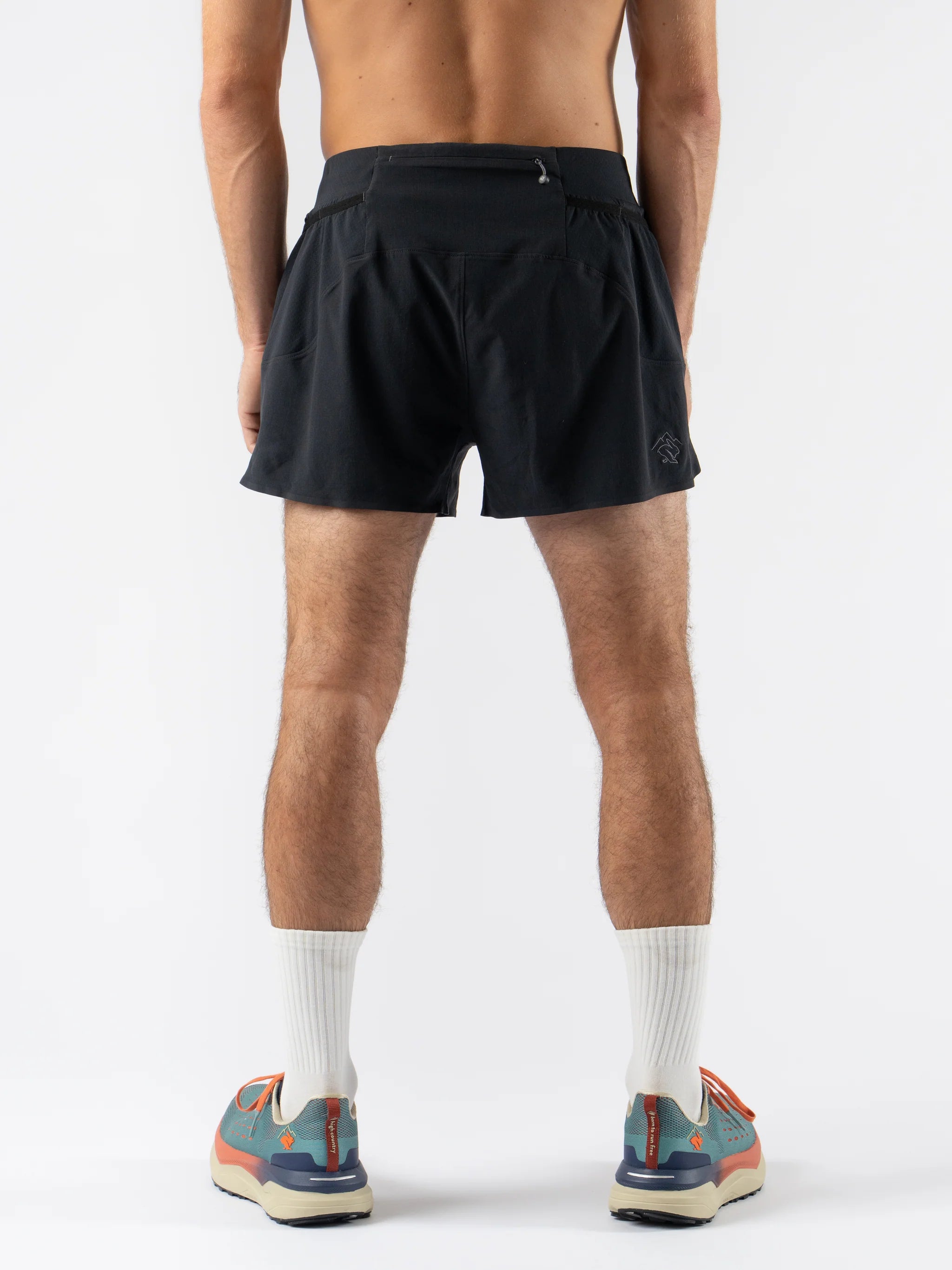 FKT 3 - Men in black by Rabbit, technical stretch fabric trail shorts with dialed fit for running and outdoor performance