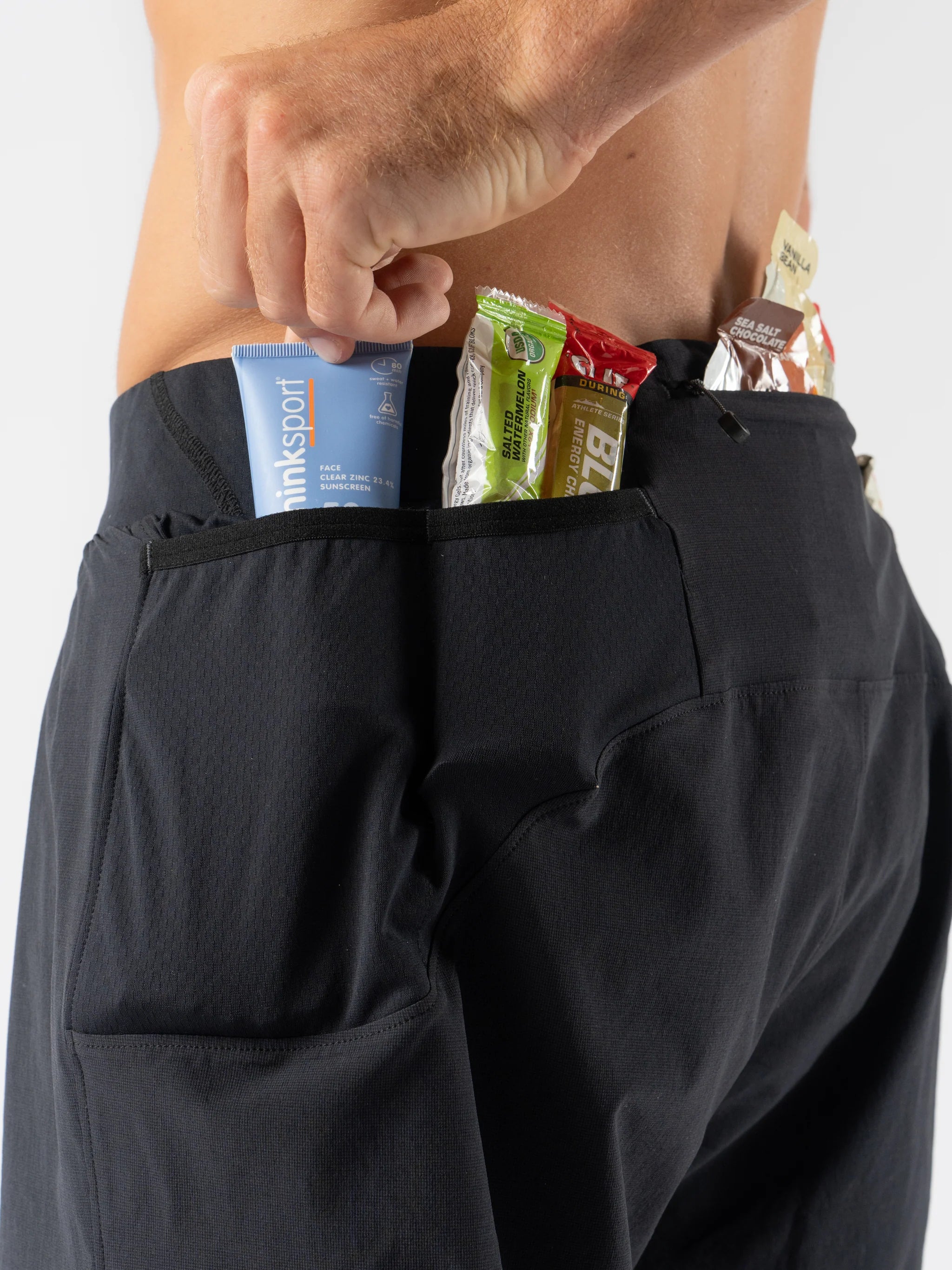 FKT 3 - Men by Rabbit in black, technical stretch trail shorts with dialed fit and multiple rear pockets for running and outdoor use