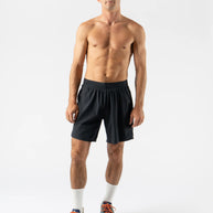 FKT 7 - Men by Rabbit in black lightweight stretch shorts with semi-relaxed fit for breathable comfort and trail running durability