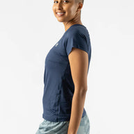Woman wearing navy ICE Perf Tee SS - Women by Rabbit, soft, quick-dry, perforated sustainable nylon, ideal for running and active use.