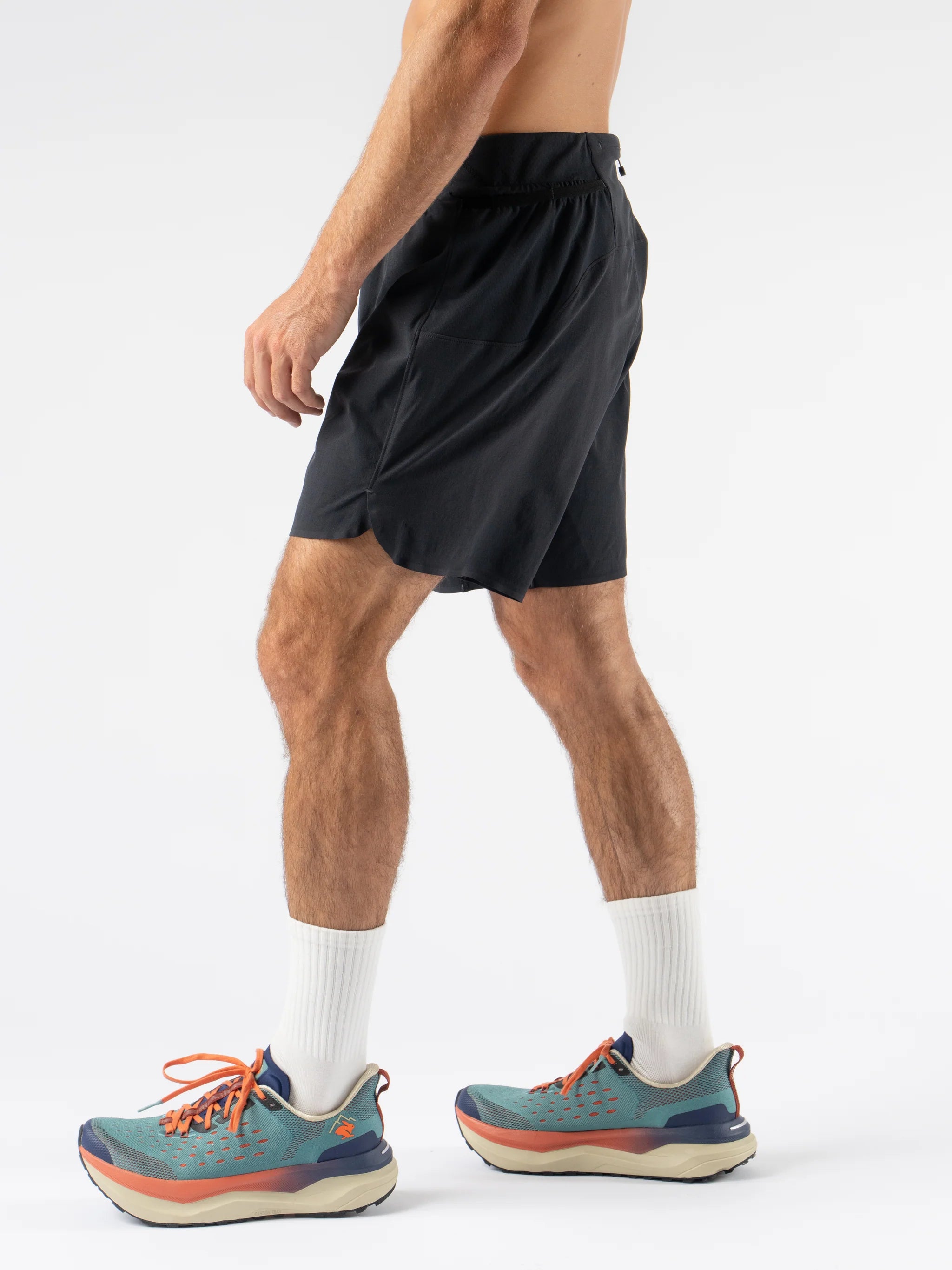 FKT 7 - Men by Rabbit in black technical stretch shorts with semi-relaxed fit, lightweight and breathable for trail running and outdoor use