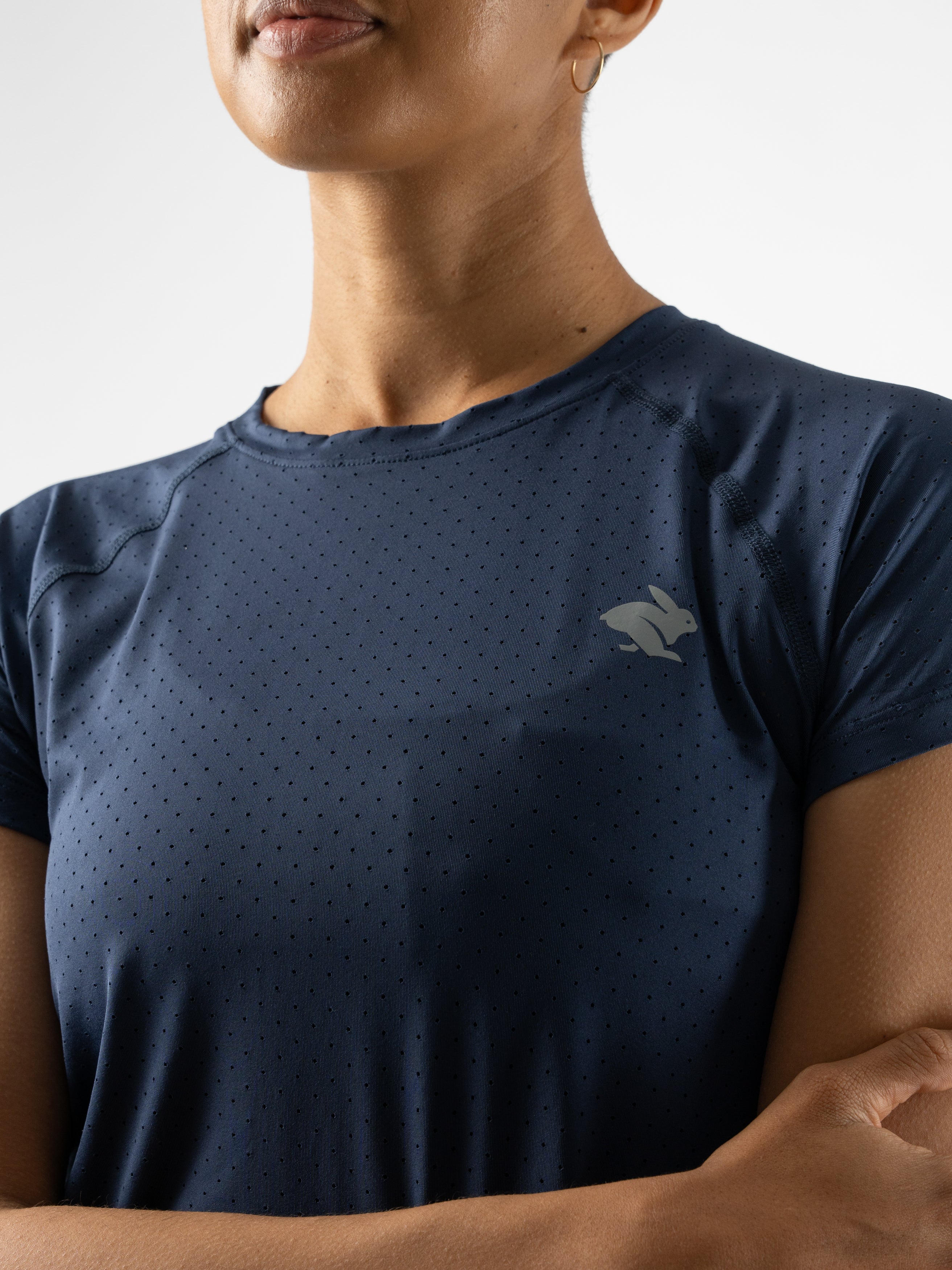 ICE Perf Tee SS - Women in navy blue by Rabbit, lightweight, breathable with all-over perforation, sustainable quick-dry nylon ideal for running.