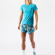 Woman wearing Rabbit ICE Perf Tee SS - Women in blue, lightweight, soft, sustainable nylon from recycled coffee grounds, quick drying, perfed design ideal for running.