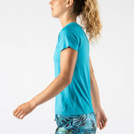 Woman wearing Rabbit ICE Perf Tee SS - Women in turquoise, lightweight, soft, perforated, quick-dry sustainable nylon perfect for running in Canada.