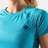ICE Perf Tee SS - Women in turquoise by Rabbit, lightweight perforated tech tee made from recycled coffee nylon, quick-drying and soft.
