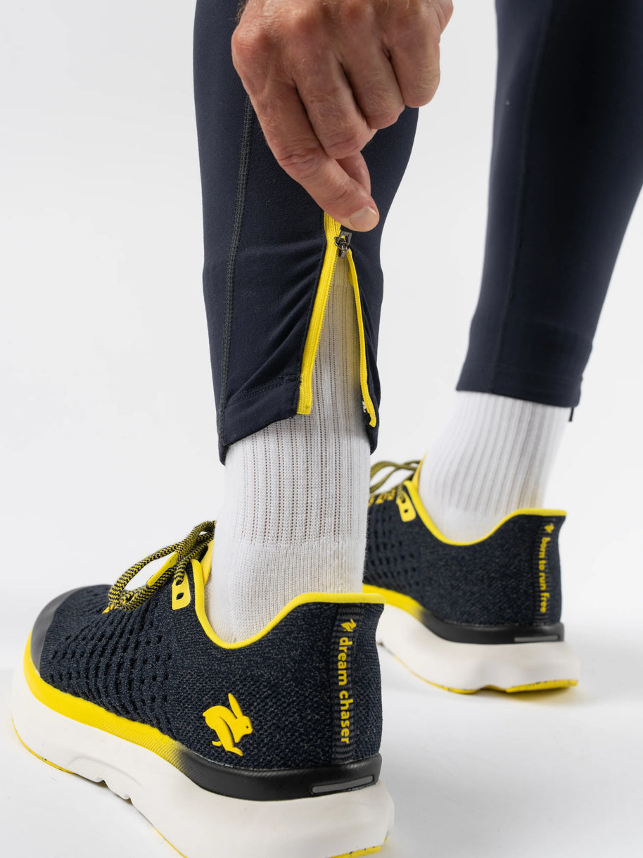 Low Light Pocket Tightz - Men by Rabbit in black with yellow accents, midweight reflective running tights with pockets for safety and warmth
