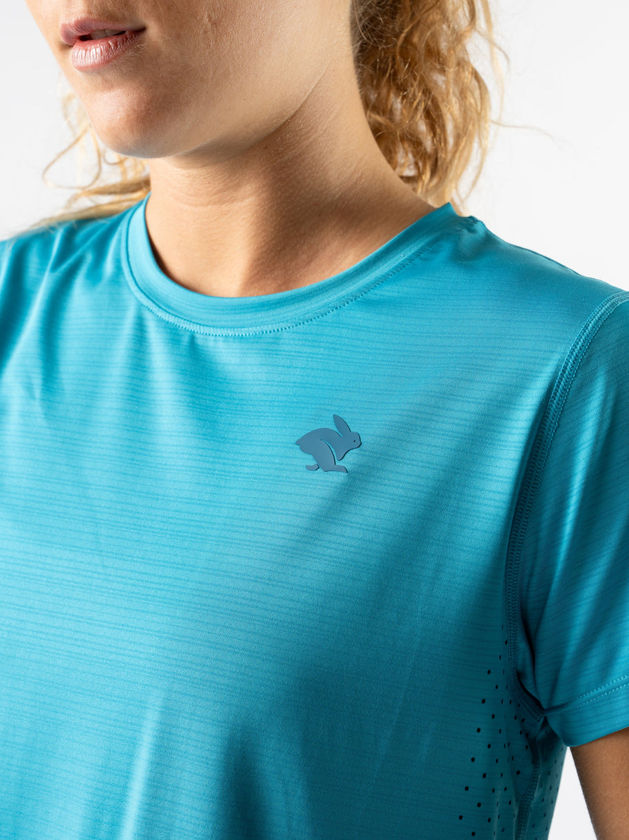 UPF Tee SS - Women by Rabbit in blue lightweight jersey with laser-cut underarm perfs, UPF 50 protection for sun safety and outdoor use