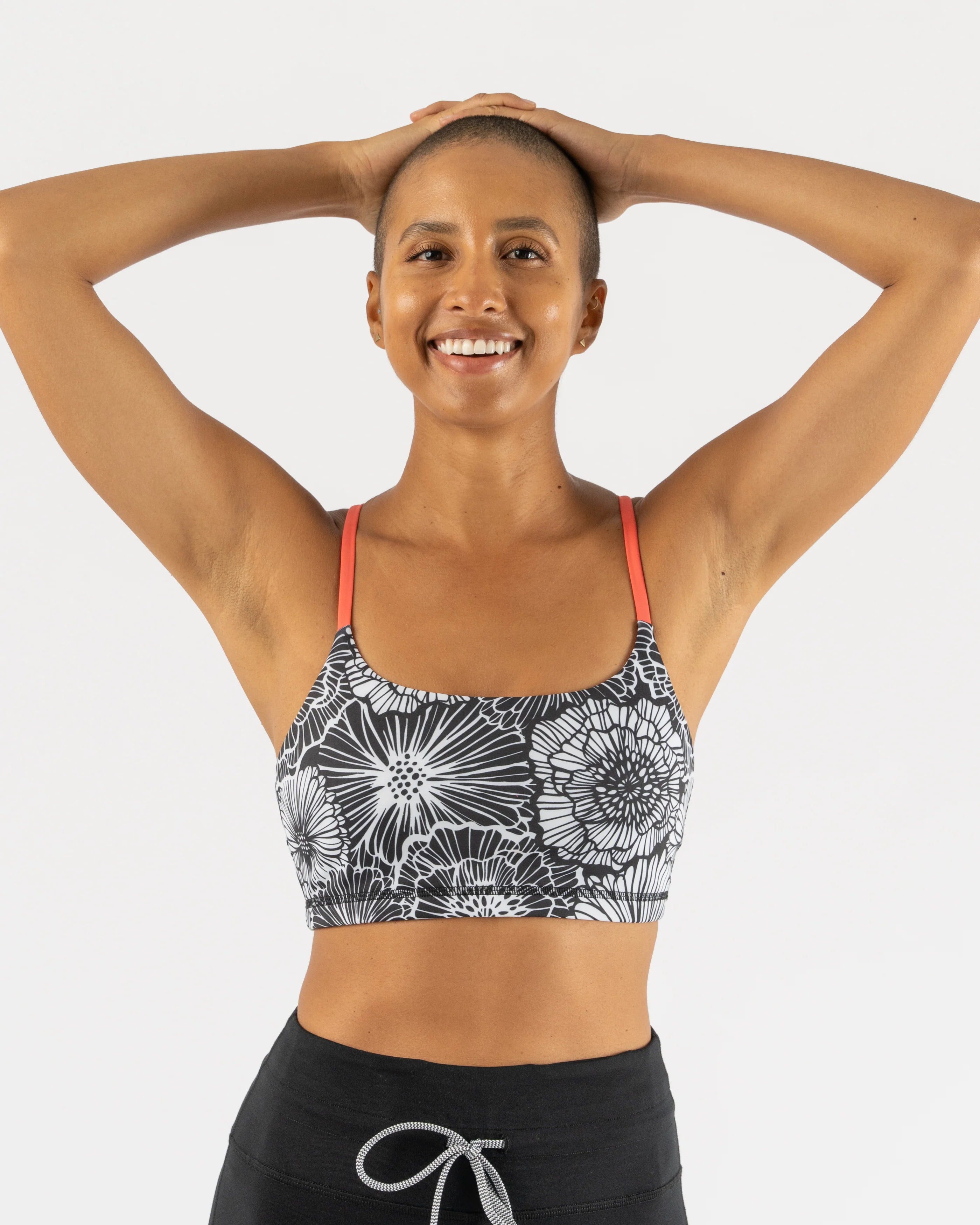 EZ Bra-Vo by Rabbit in black and white floral print with coral straps, light support bra ideal for active and rest days comfort
