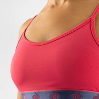 Strappy Pocket Bra - Women by Rabbit in red with blue logo band, built-in pocket, minimal bounce, comfortable for running and activewear