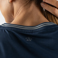 Race Pace Tee SS - Women by Rabbit in navy with breathable laser-cut perforations and micro-textured inside for running and training comfort