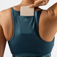 Strappy Pocket Bra - Women by Rabbit in dark teal with built-in pocket, minimal bounce, and comfort for secure storage during running and workouts