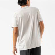 UPF Tee SS - Men by Rabbit in moonlight color, lightweight breathable shirt with UPF 50 protection and laser-cut arm vents for outdoor running.