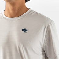 UPF Tee SS - Men by Rabbit in light grey with UPF 50 protection, lightweight breathable jersey, and laser-cut underarm vents for sun safety and running comfort