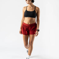 Fuel 'N Fly 4 - Women by Rabbit in red shorts with five pockets, lightweight and versatile for long-distance running and outdoor use