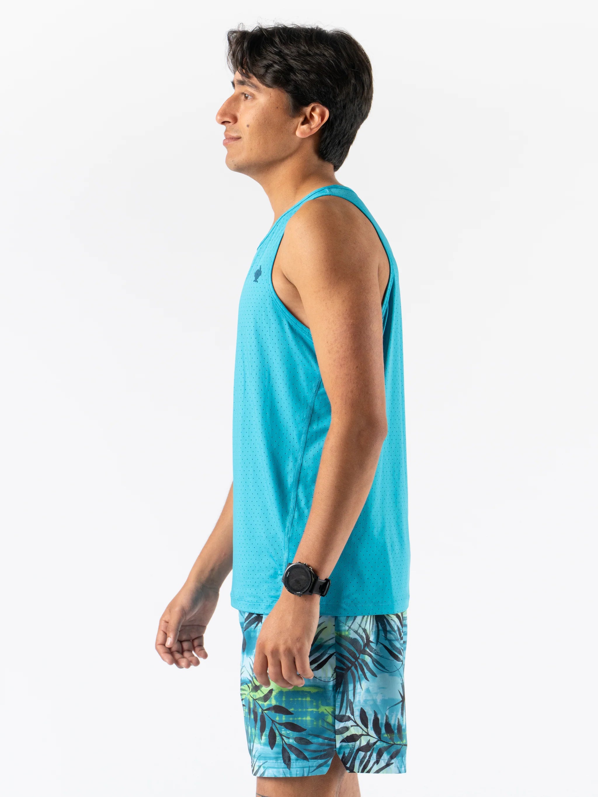 Man wearing Rabbit Ice Perf Tank - Men in bright blue with breathable perforations, sustainable nylon, ideal for running and gym workouts in Canada