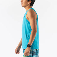 Man wearing Rabbit Ice Perf Tank - Men in bright blue with breathable perforations, sustainable nylon, ideal for running and gym workouts in Canada
