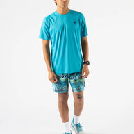 Man wearing turquoise ICE Perf Tee SS - Men by Rabbit, lightweight perforated nylon tee made from recycled coffee, quick-dry technology