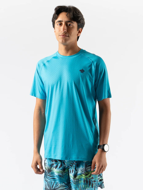 Man wearing turquoise ICE Perf Tee SS - Men by Rabbit, lightweight perforated sustainable nylon tee ideal for quick drying and active use.