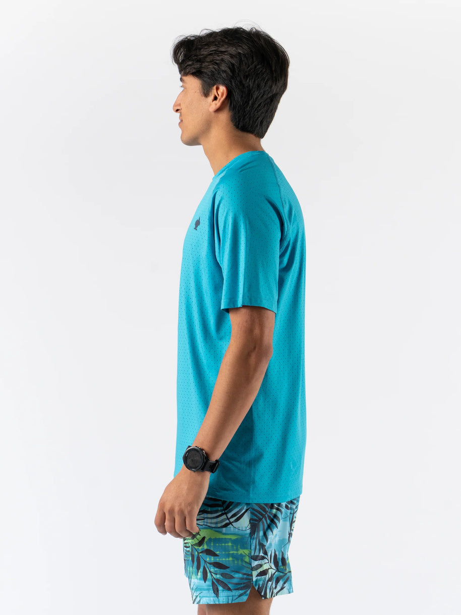Side view of man wearing turquoise ICE Perf Tee SS - Men by Rabbit, lightweight, soft, quick-drying sustainable nylon for active use