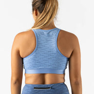 Utili Bra-Vo by Rabbit in light blue, multifunctional sports bra with laser-cut pocket, minimizes bounce for running and active use