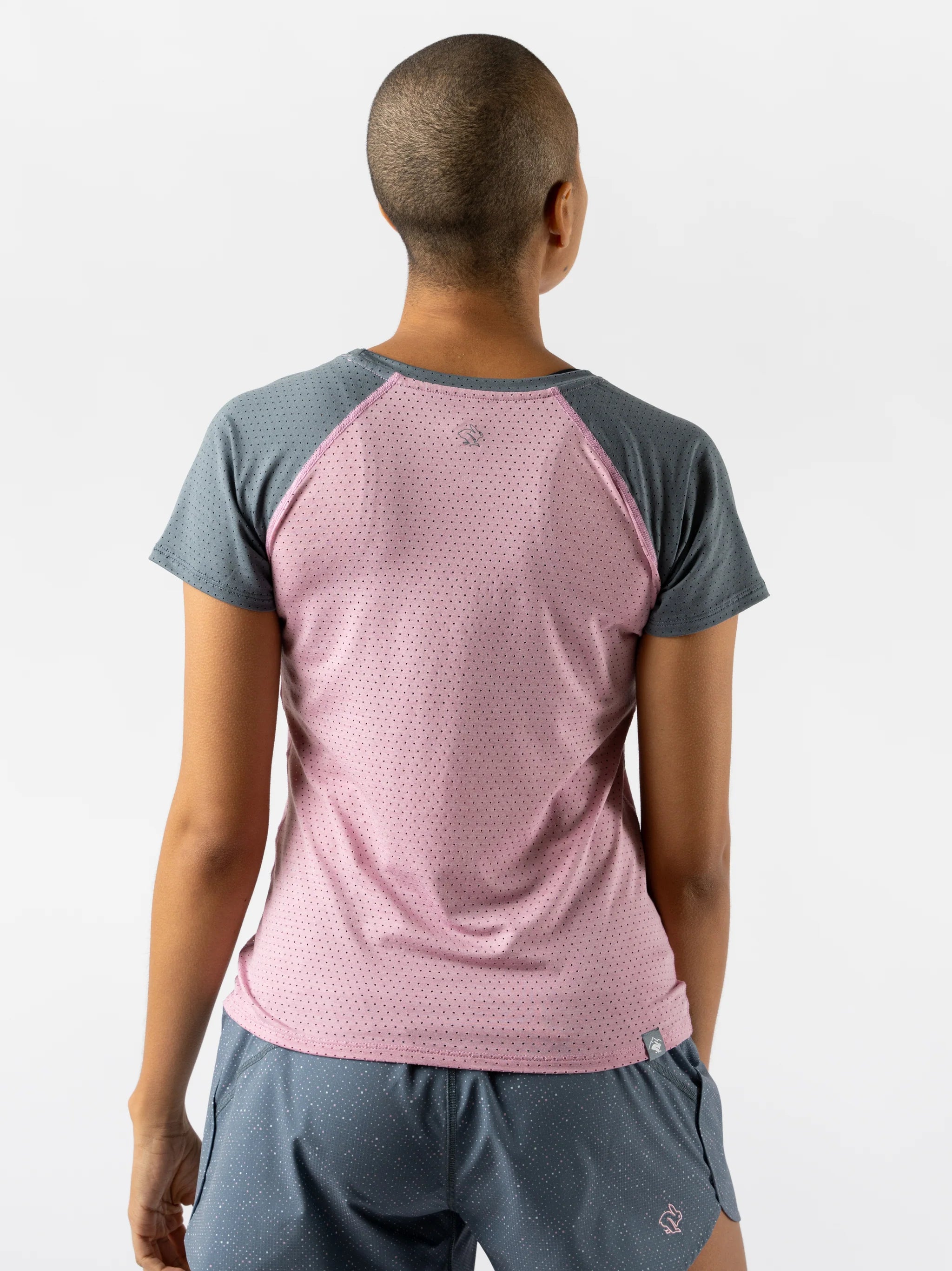 EZ Tee Perf SS Trail - Women by Rabbit in pink and grey, lightweight breathable trail running top with perforations for ventilation and comfort